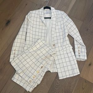 Pantsuit. Beautiful details and nice shiny gold buttons to tie it all together.